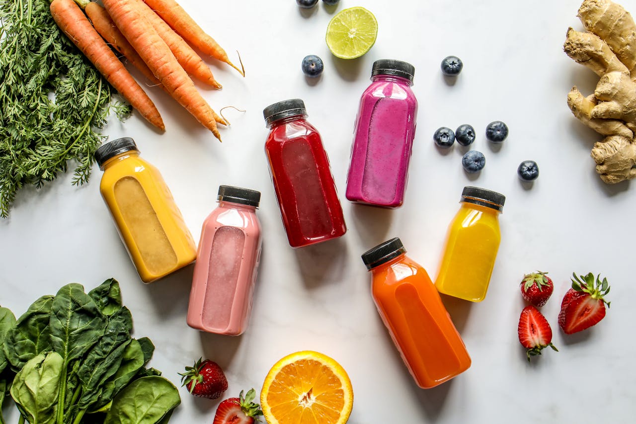 Overhead Photo of Colorful Bottles with Smoothies