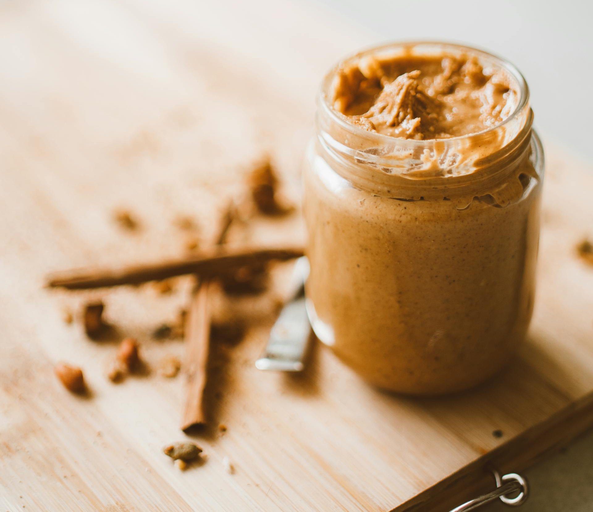 Jar with Peanut Butter on Table