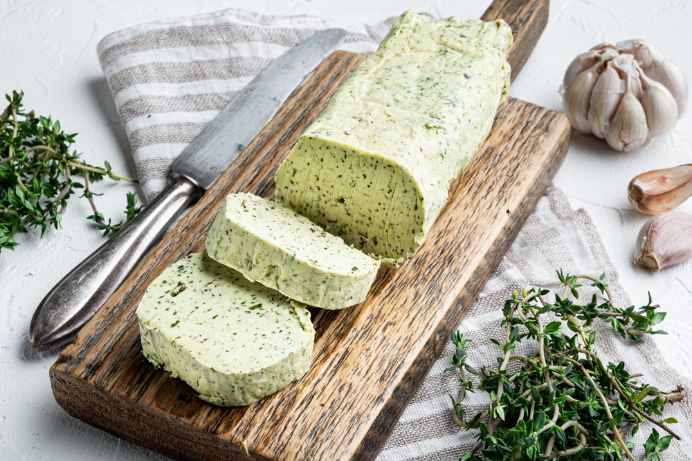 Close Up Photo of Dairy green butter with herbs