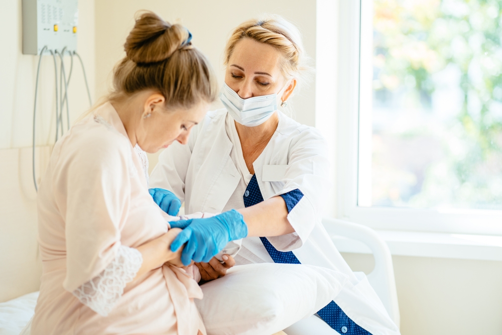 Mother breastfeeding newborn baby in hospital