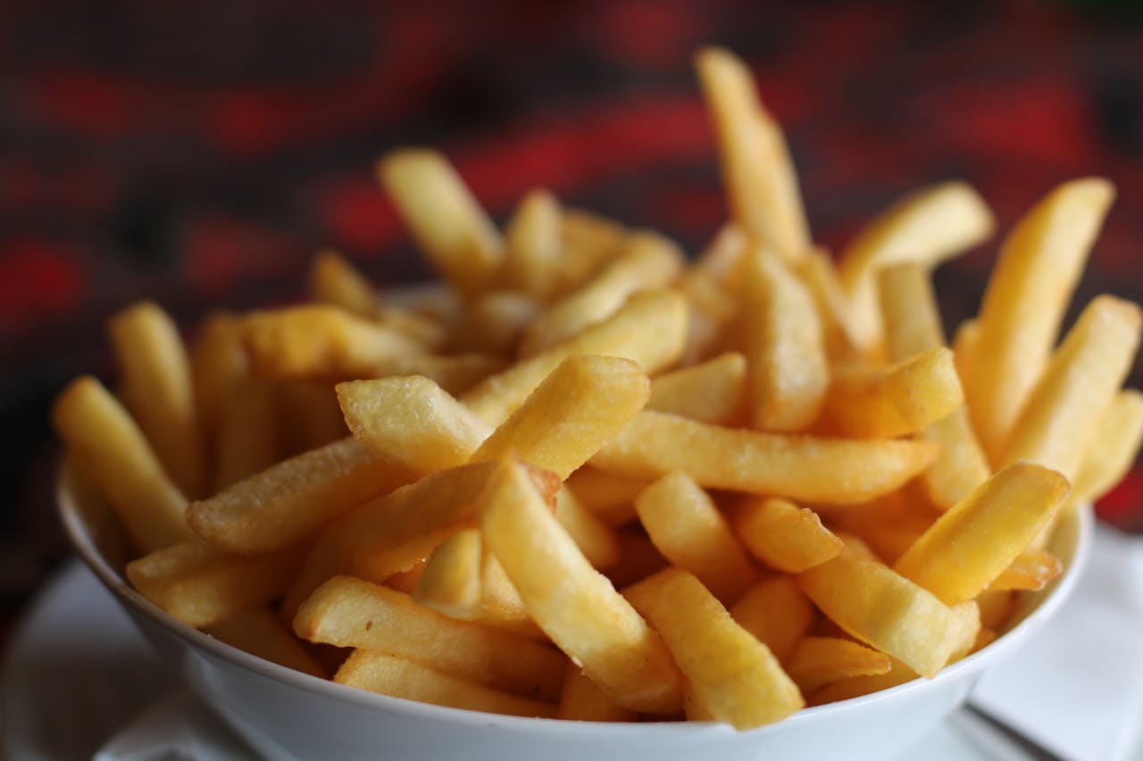 Close Up Photo of Fried Potatoes on a white bowl