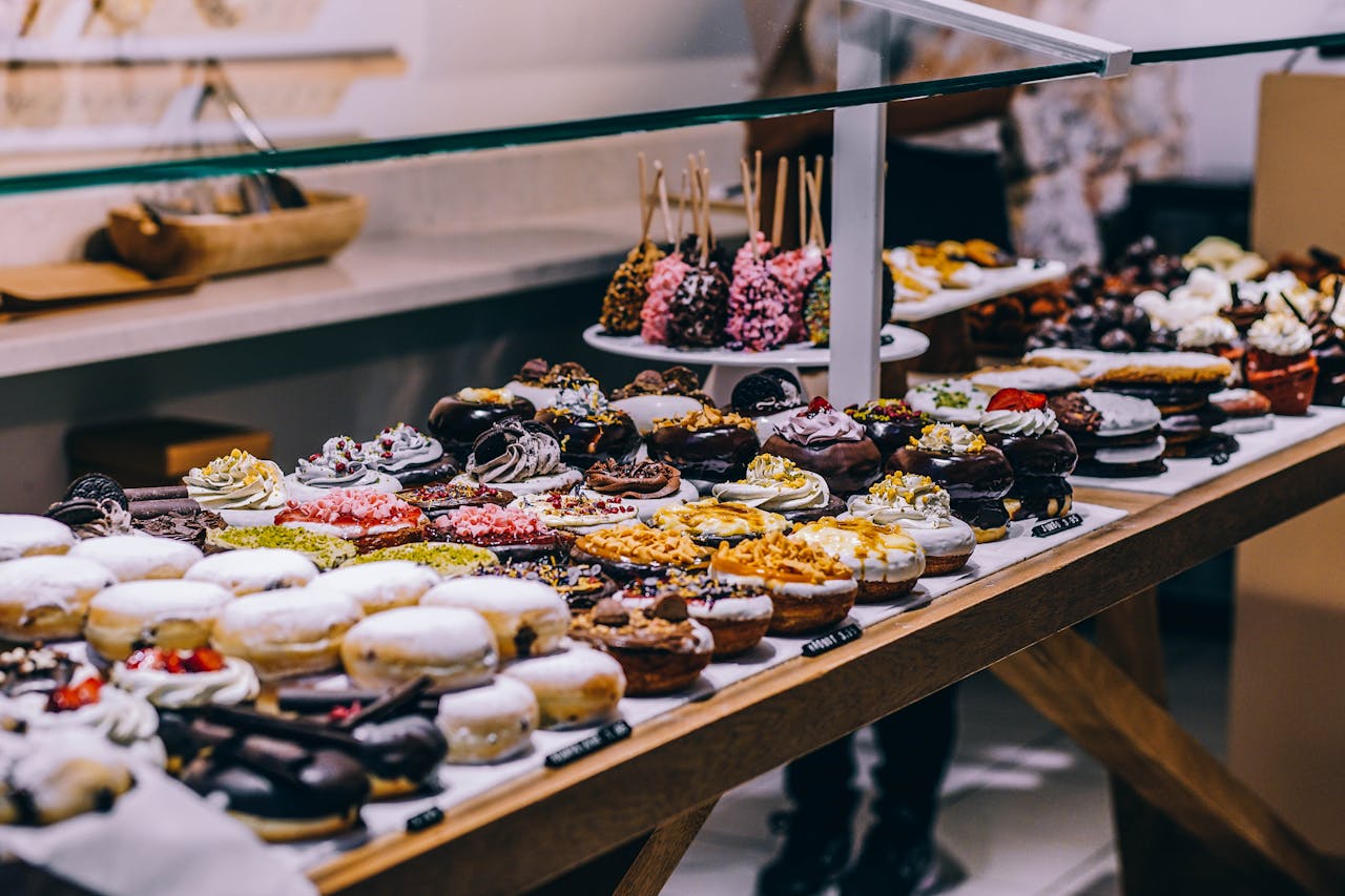 Close Up Photo of Donuts and Bagel Displayed on a table