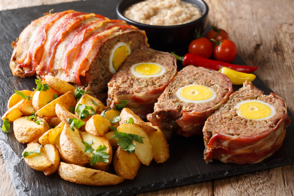 Pork and beef meat loaf bound with boiled eggs.