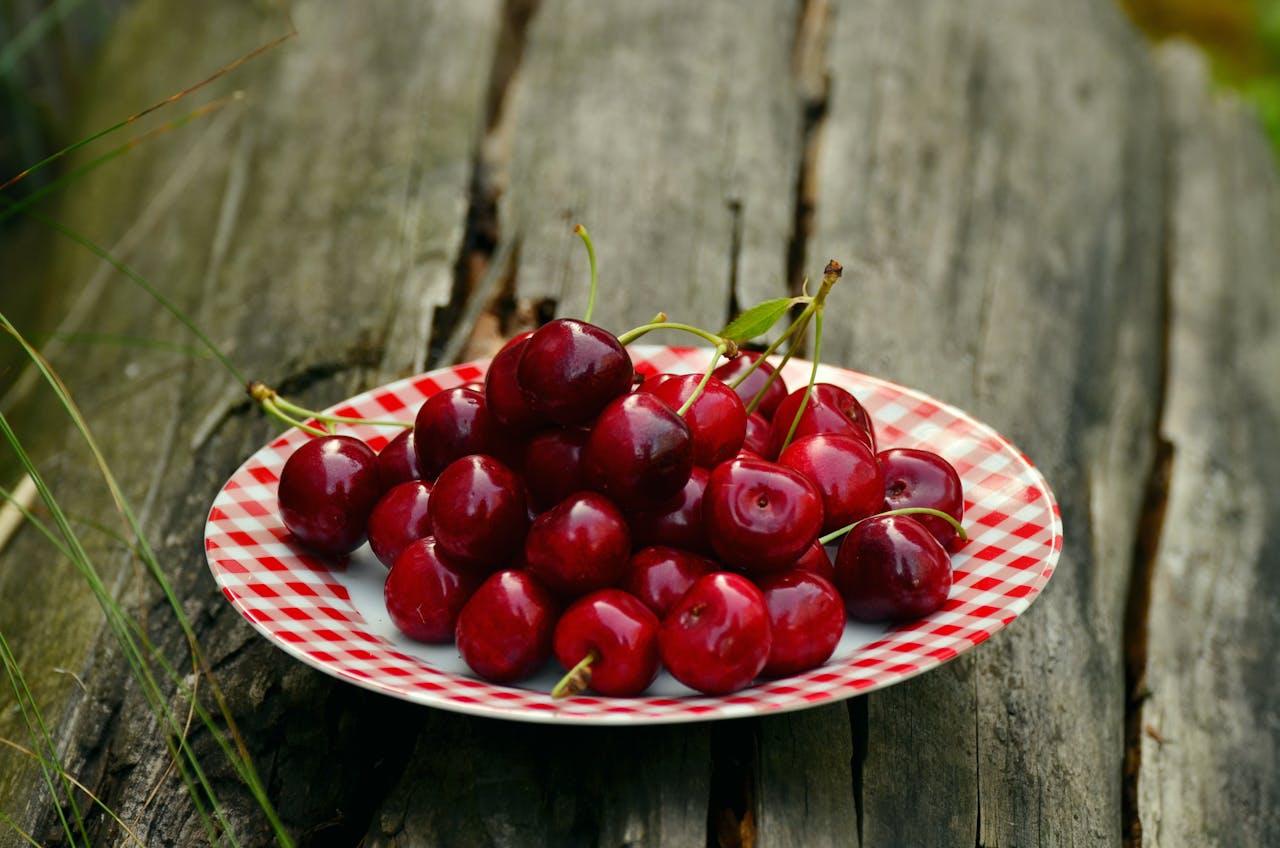Cherry Fruits on White and Red Ceramic Round Plate