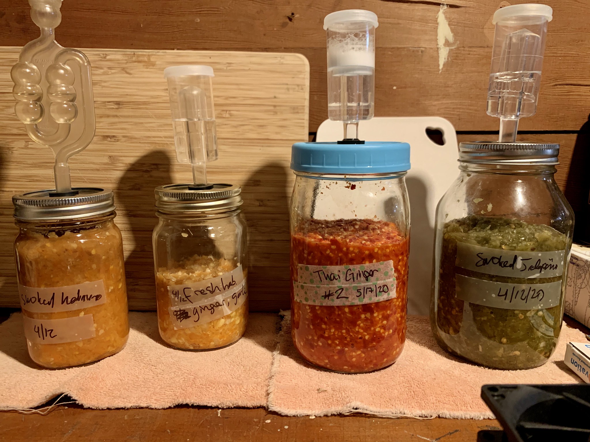 fermentation lids on jars.
