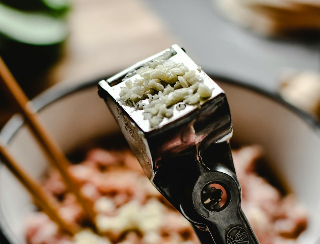 A Person Holding a Garlic Press