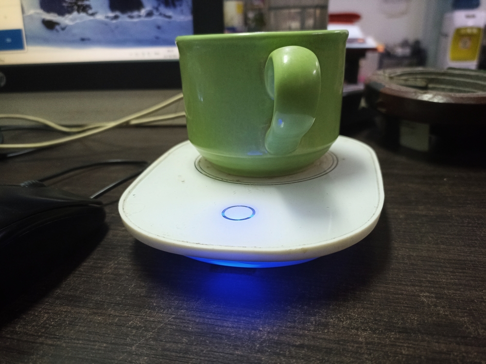 An electric cup warmer used to warm coffee