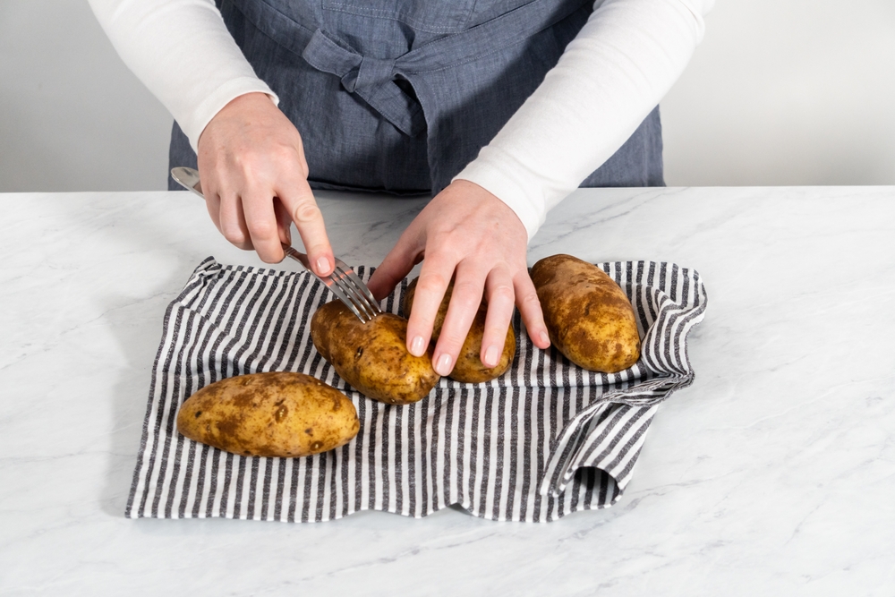 Poking raw potatoes with a fork