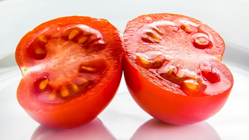 two tomato halves on white plate