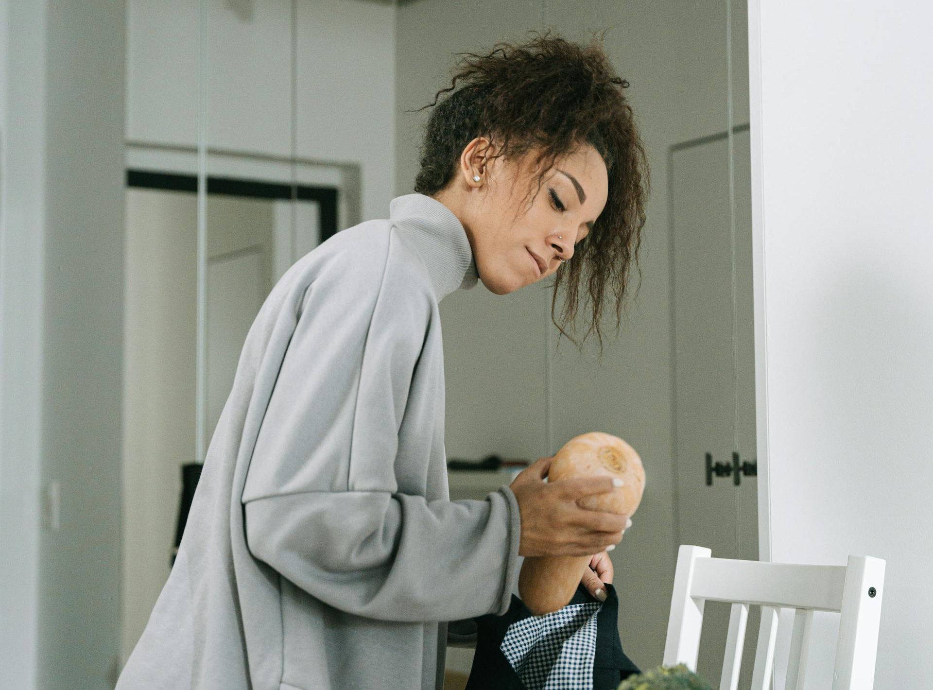 Woman holding a butternut squash