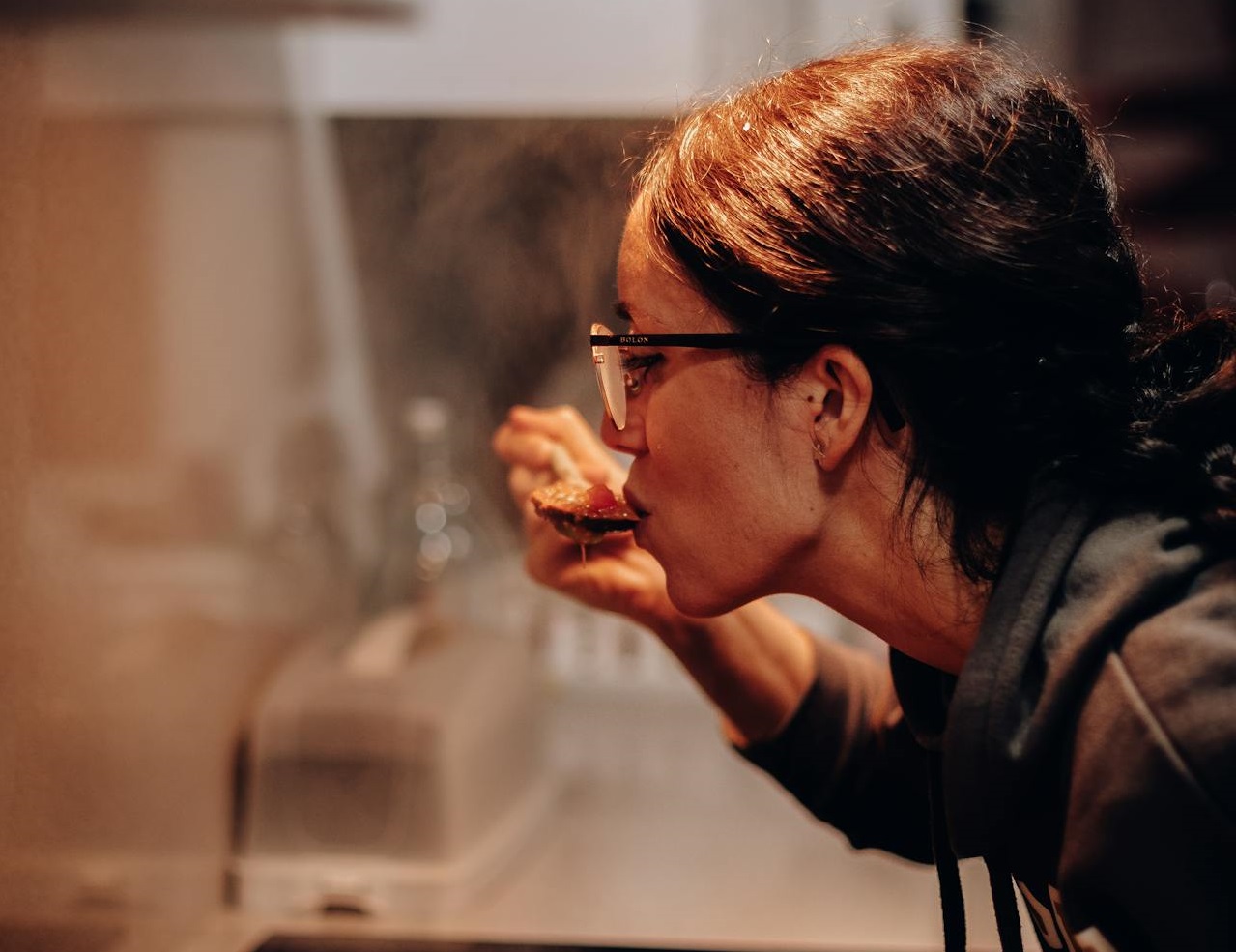 Woman Eating from Cooking Pan