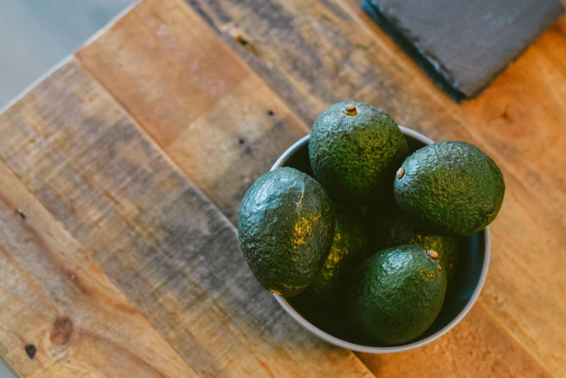 fresh green avocado in bowl