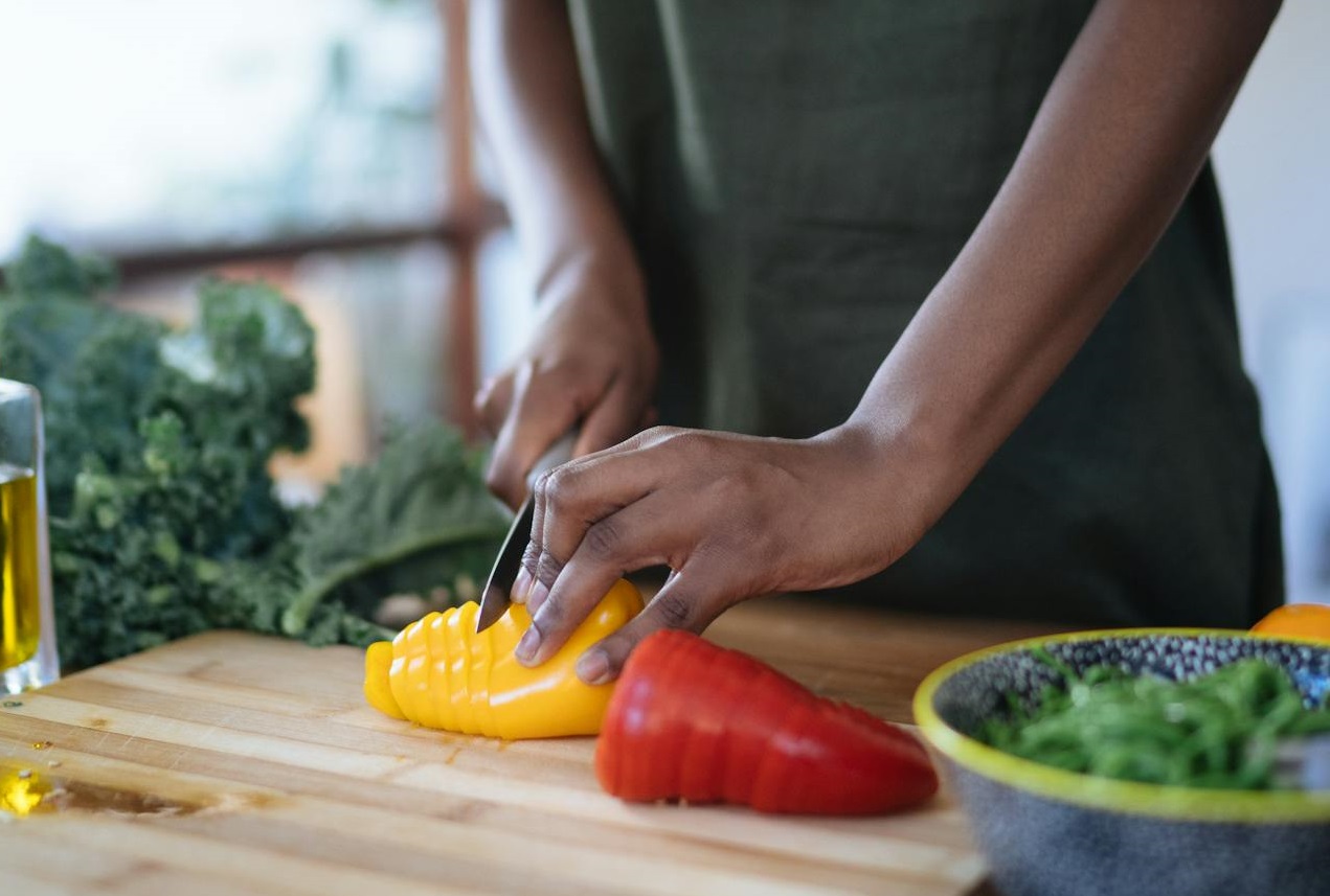 Photo Of Person Cutting Bell Peppers