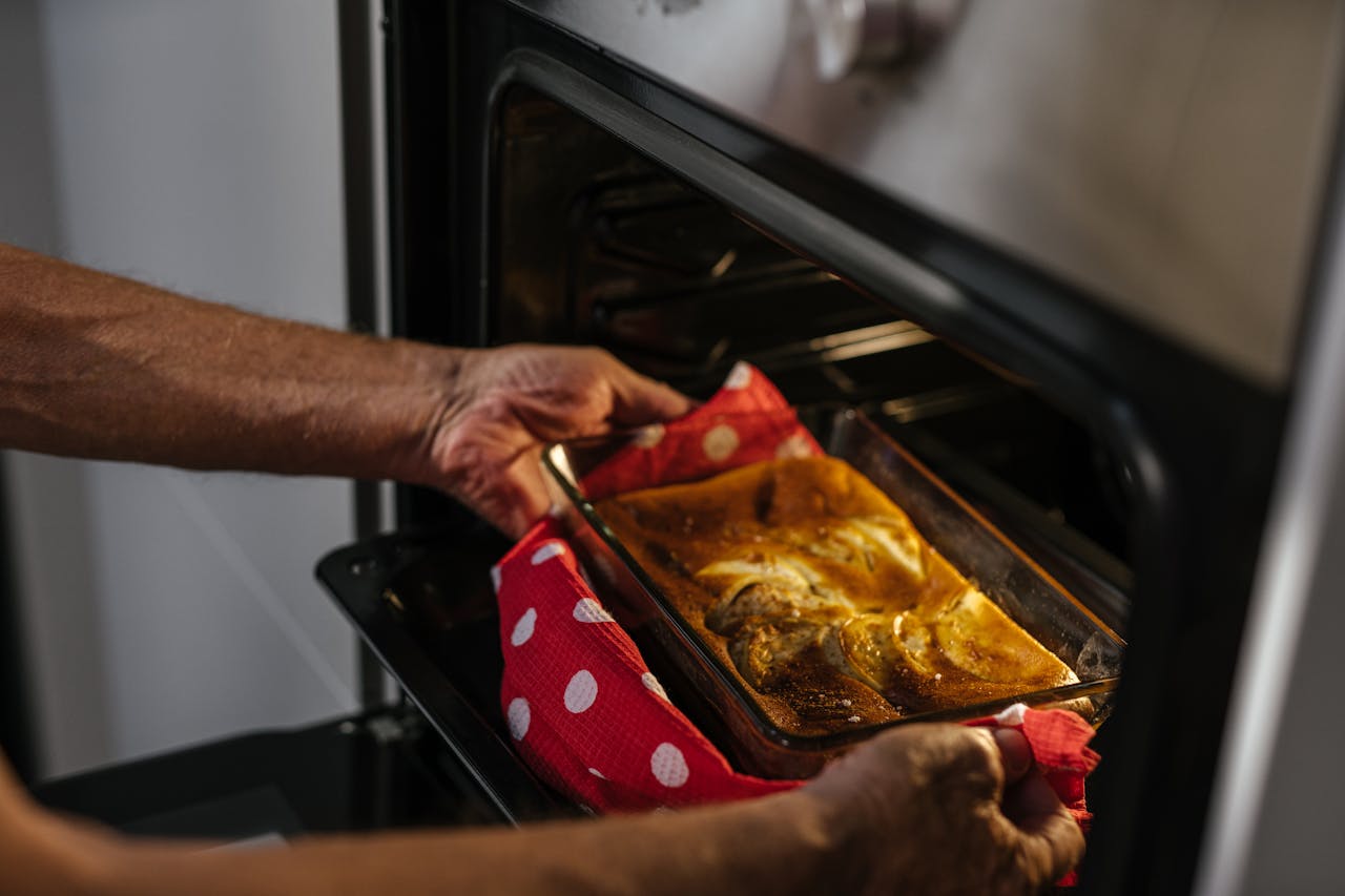 Person Taking Out pan from the Oven
