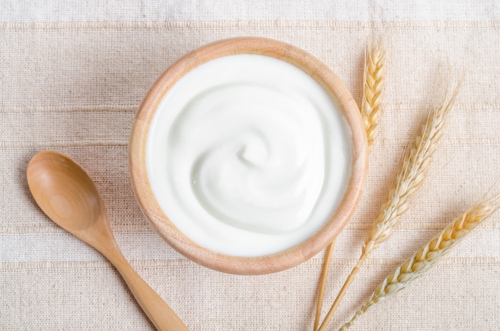 Greek yogurt in a wooden bowl