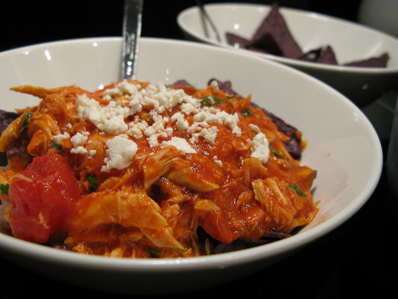 Close Up Photo of Chilaquiles on a white plate