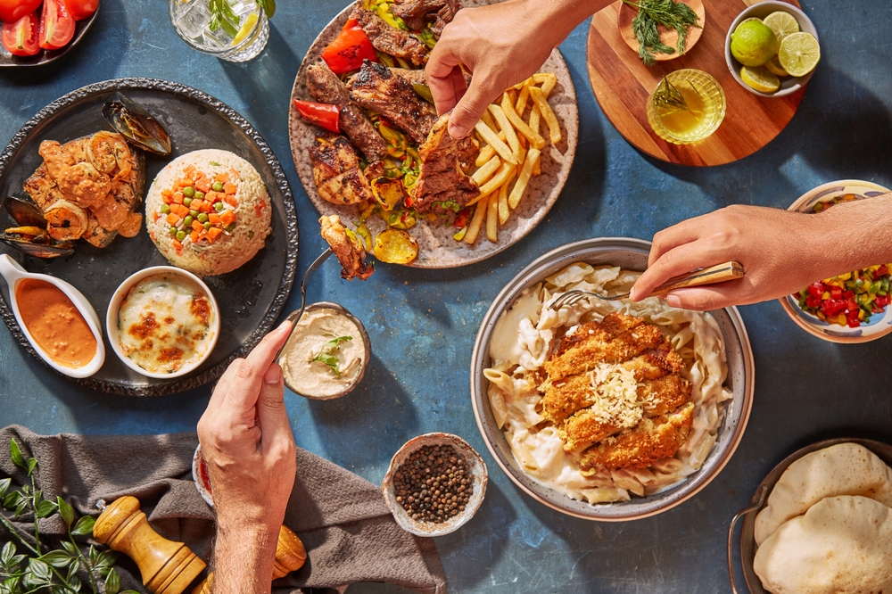 Middle Eastern or Arabic cuisine with a variety of mezze on a rustic concrete backdrop