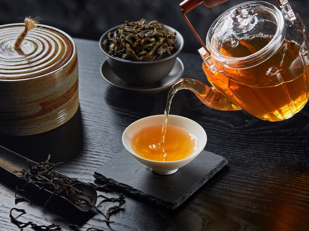 Close Up Photo of Chinese tea set placed on a wooden table
