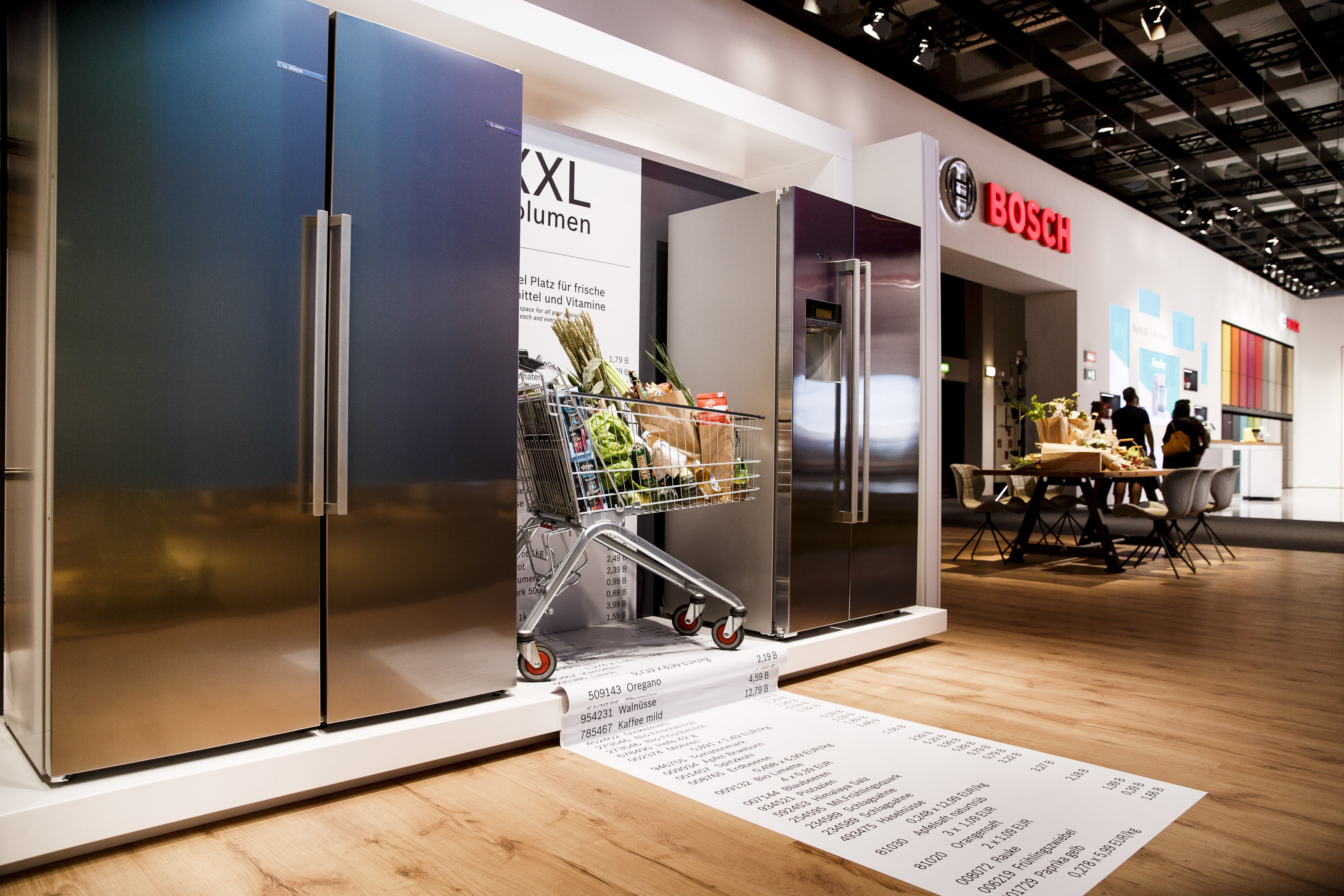 A shopping basket with a shopping list is placed between two refrigerators at the Bosch stand at the IFA electronics trade fair. - 2018