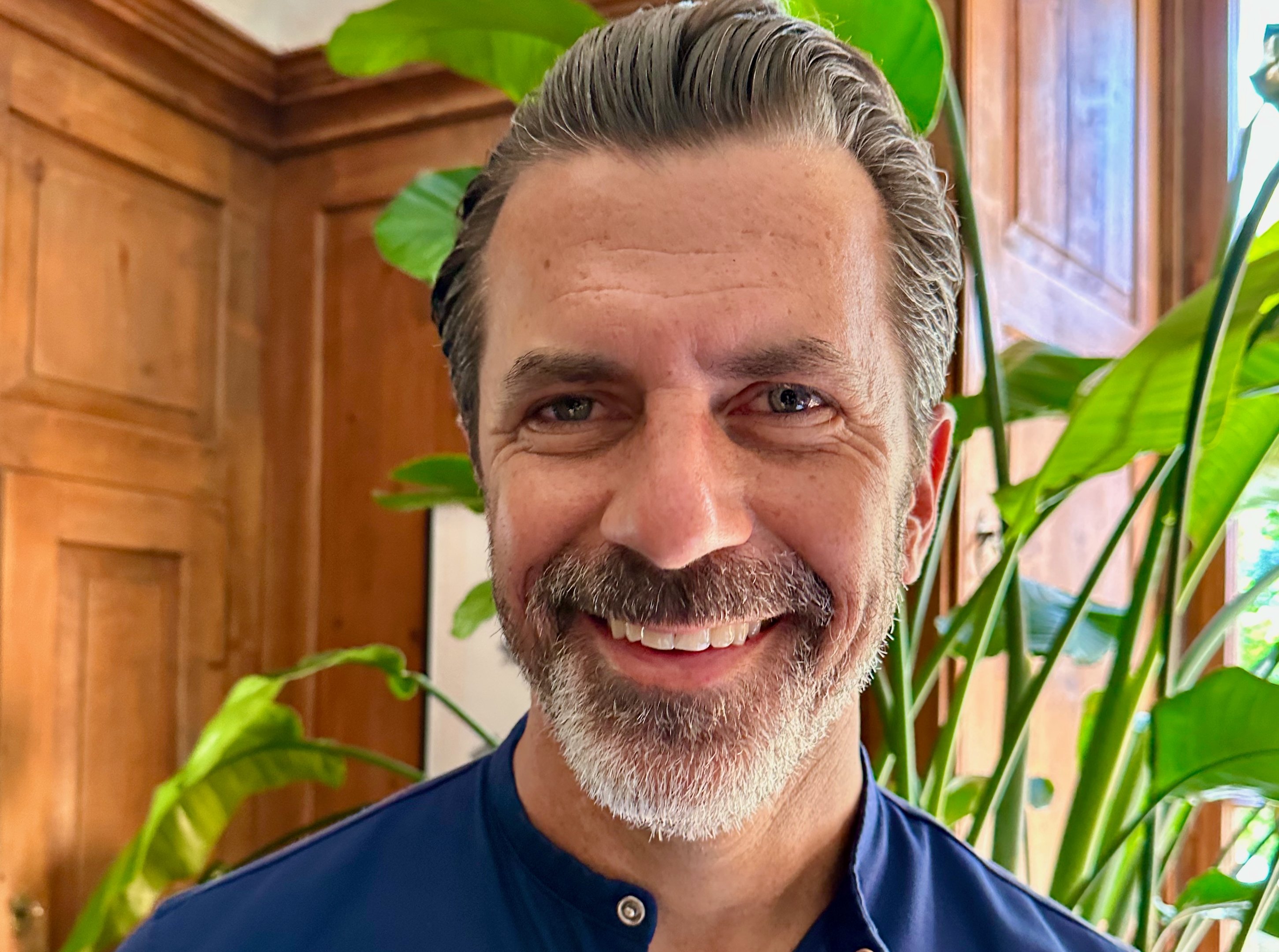 Chef Andreas Caminada in blue shirt