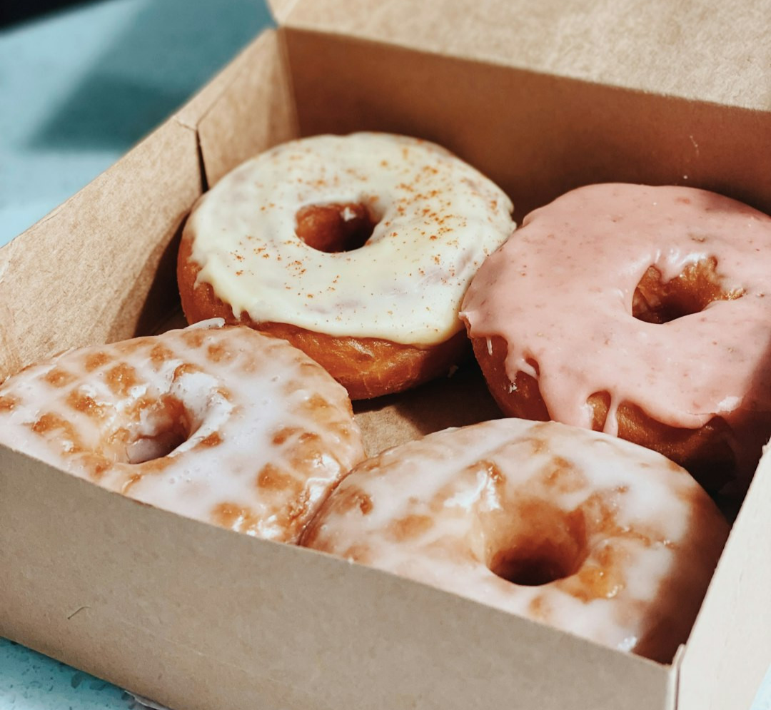 brown and white doughnuts in box