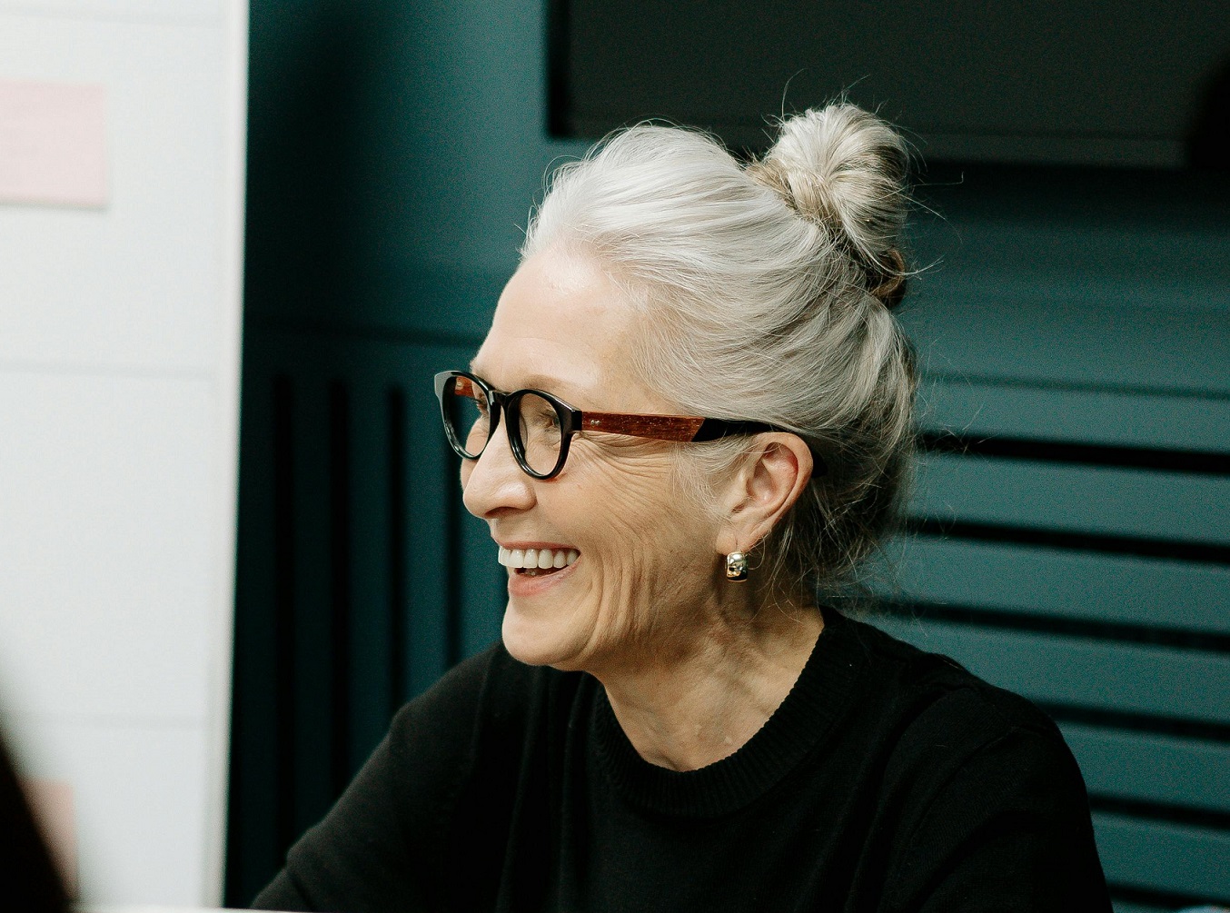 Senior woman is smiling.