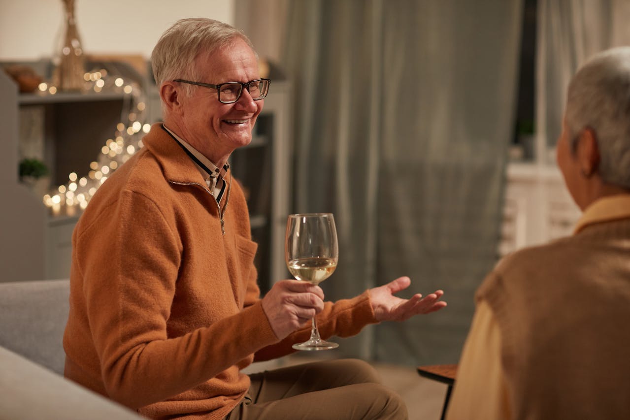 Man Smiling While Holding Wine Glass