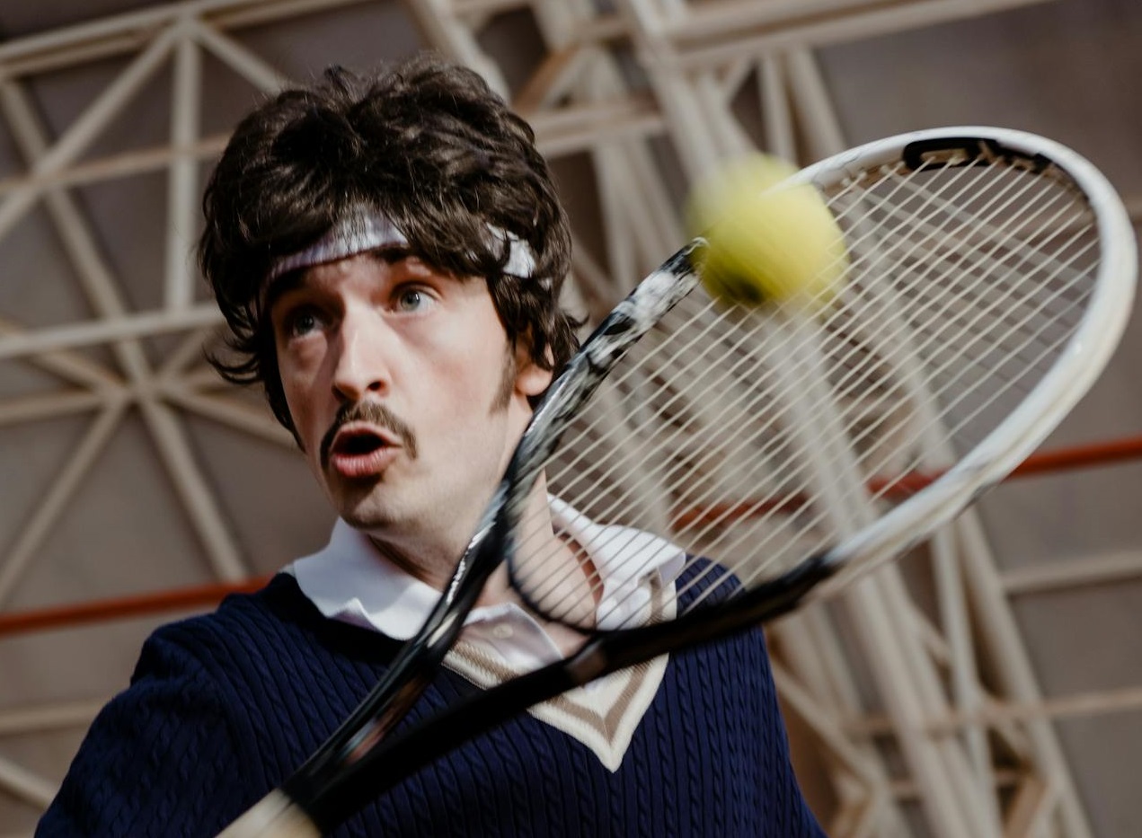 A Man Playing Tennis