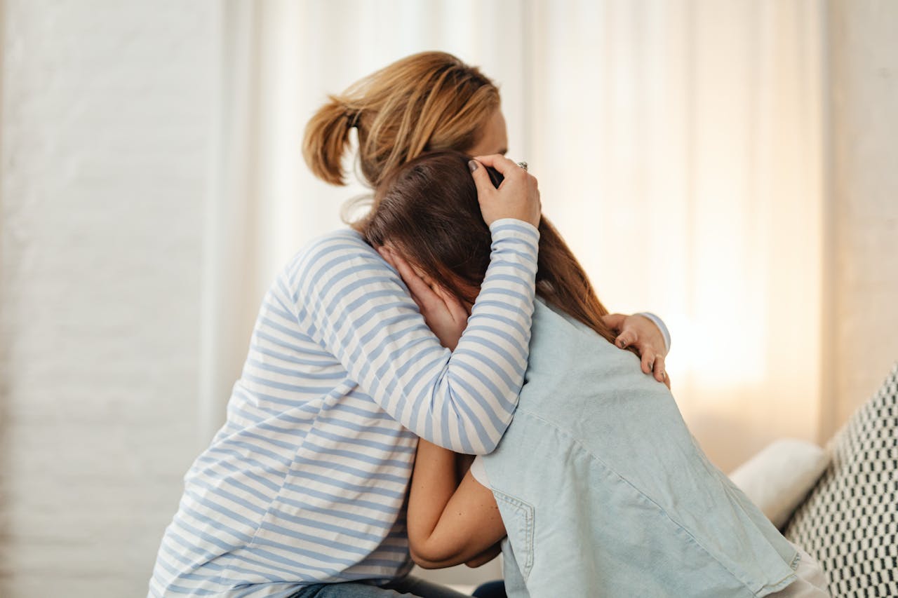 Woman Comforting Crying friend