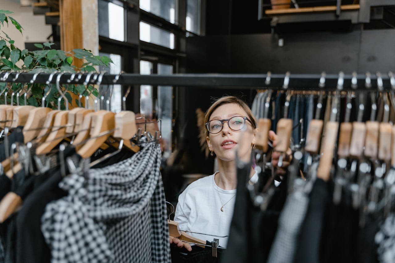 Woman looking Clothes on the Clothes Rack