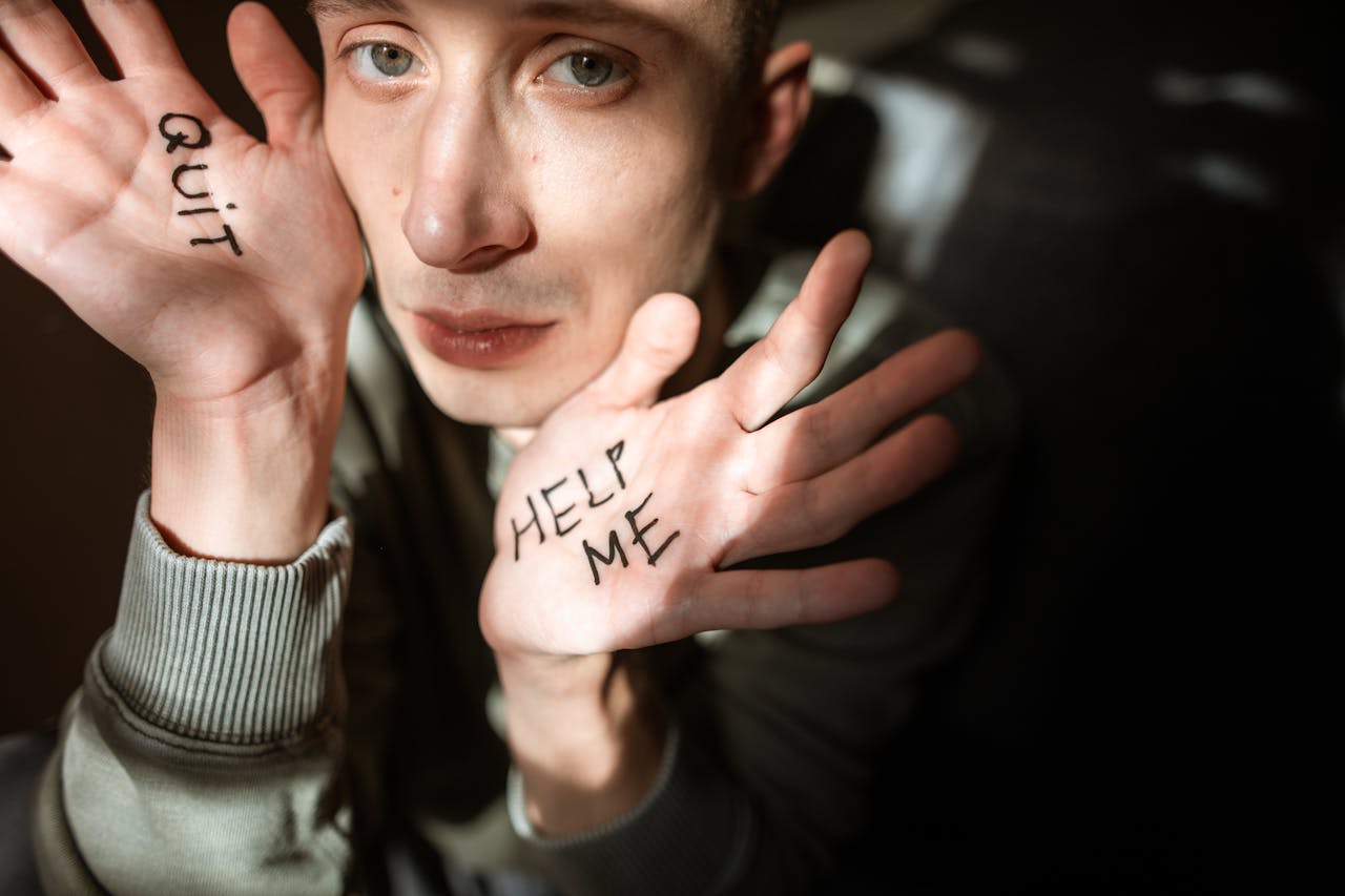 Scared man - Messages Written on Hands