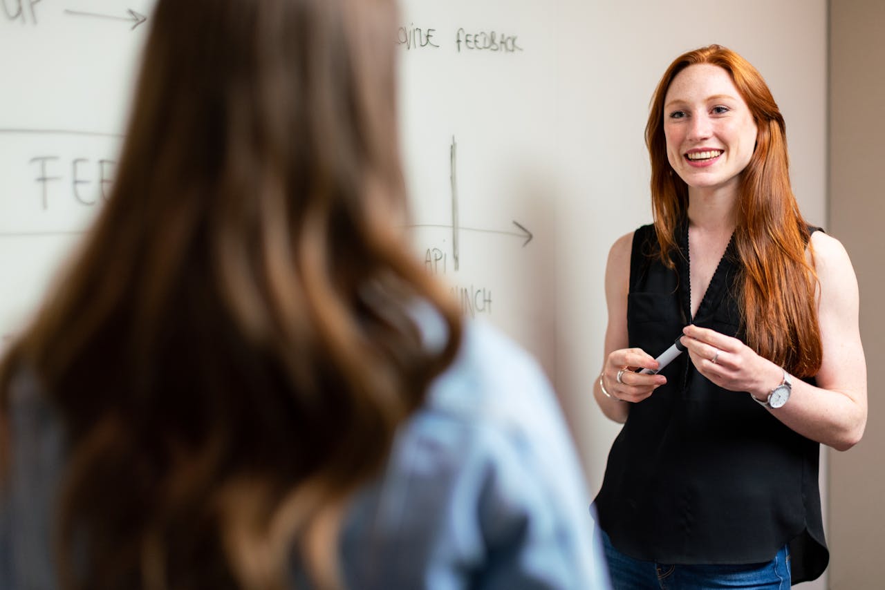 Young woman making presentation at office.