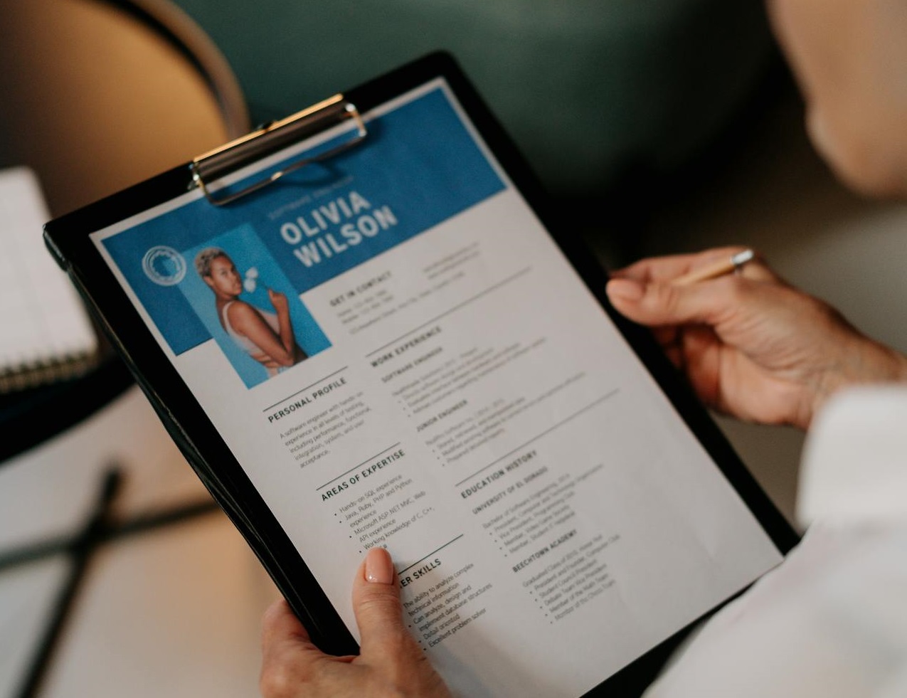 Person Holding a CV of employee.