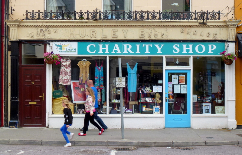 People passing by a Charity Shop