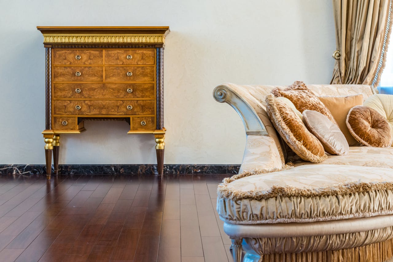 Vintage chest and settee in living room with a wooden floor