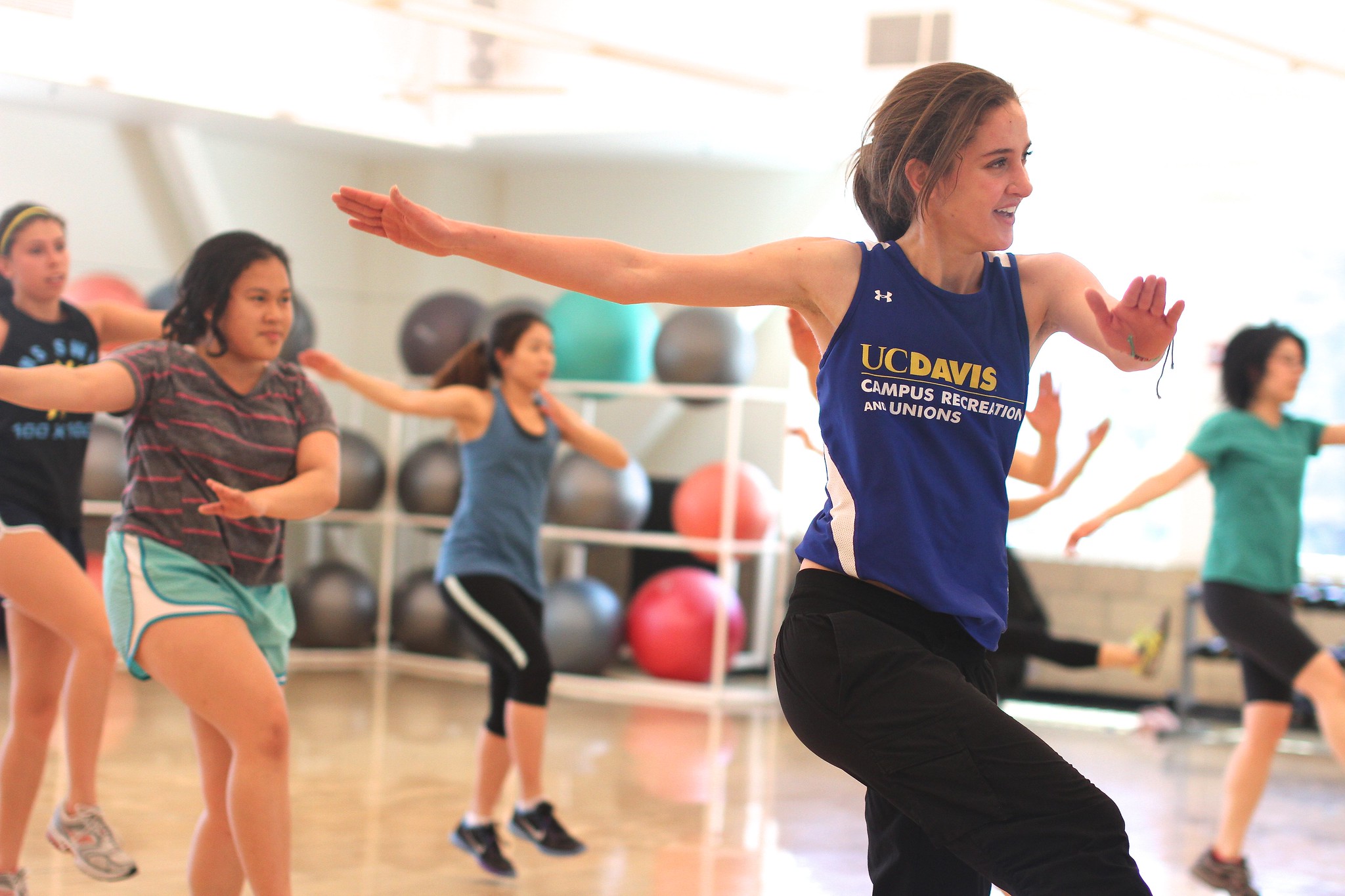 Woman dancing at Zumba class.