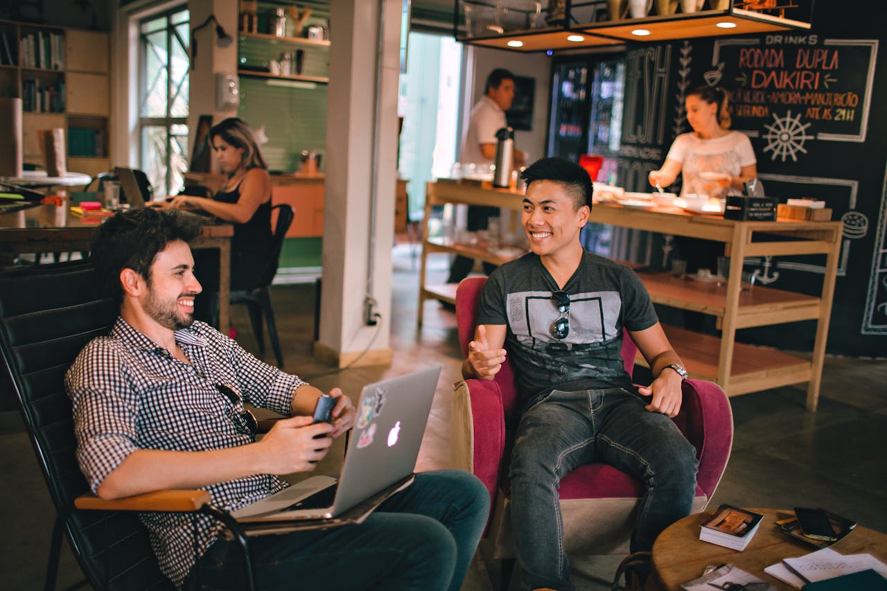 Men Having Conversation Seating on Chair