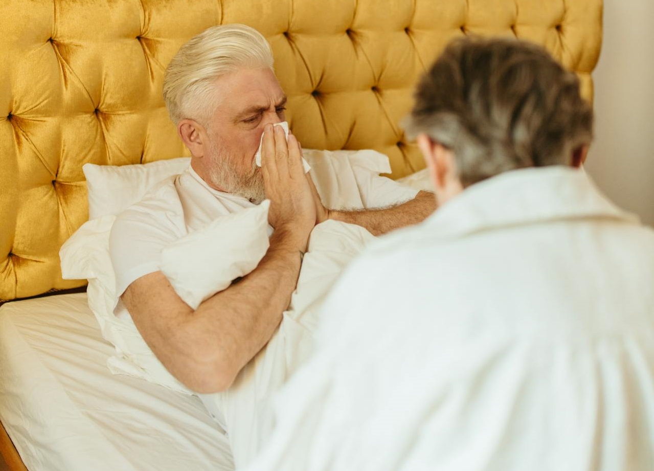 An sick Elderly Man Lying on the Bed