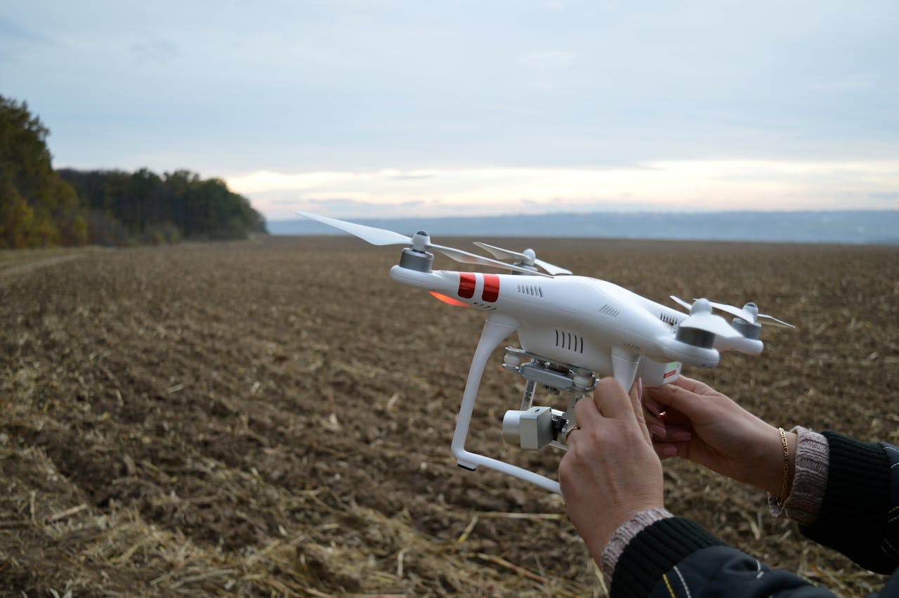 Man holding drone in nature.