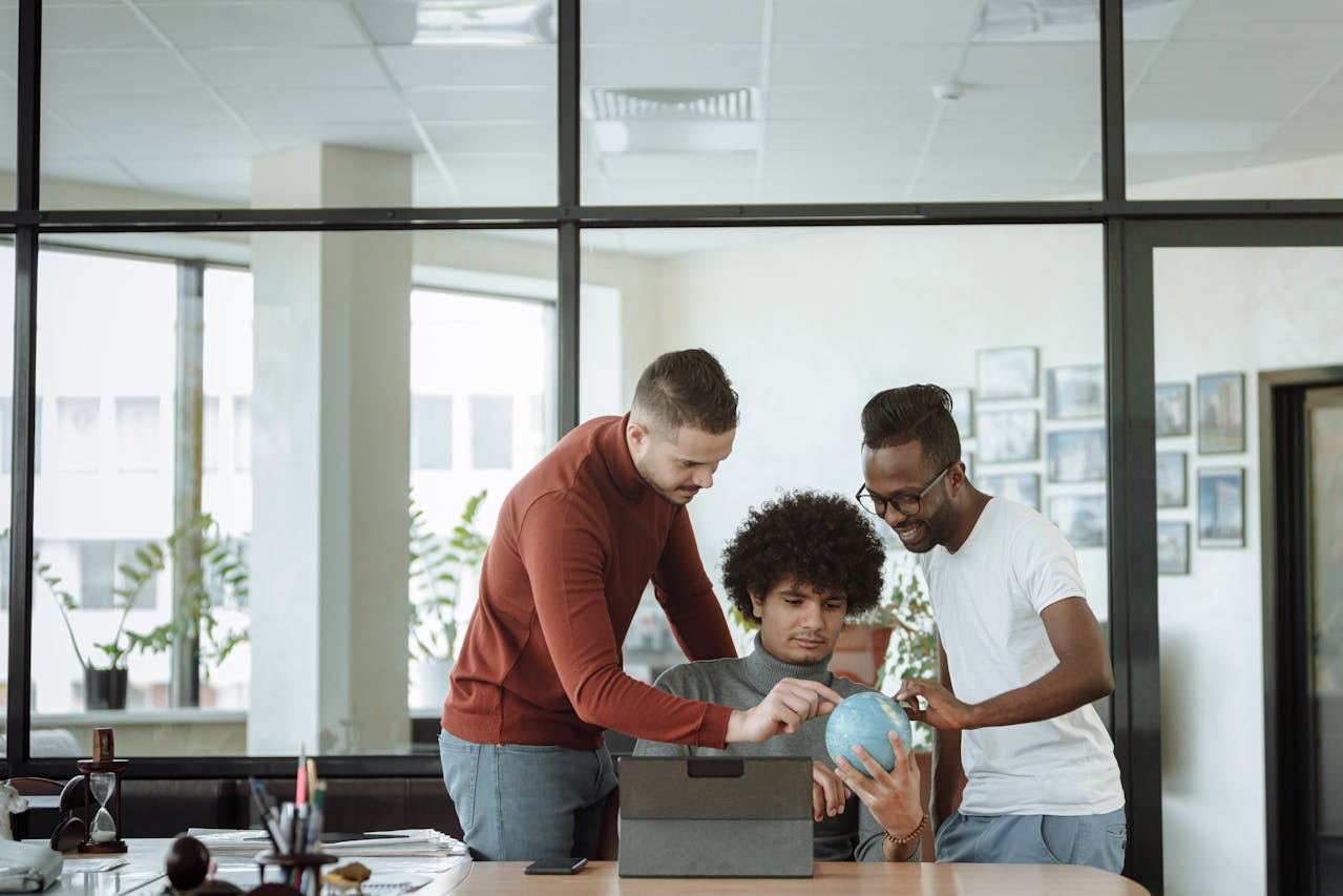 Men Having a Discussion Over a Round Object