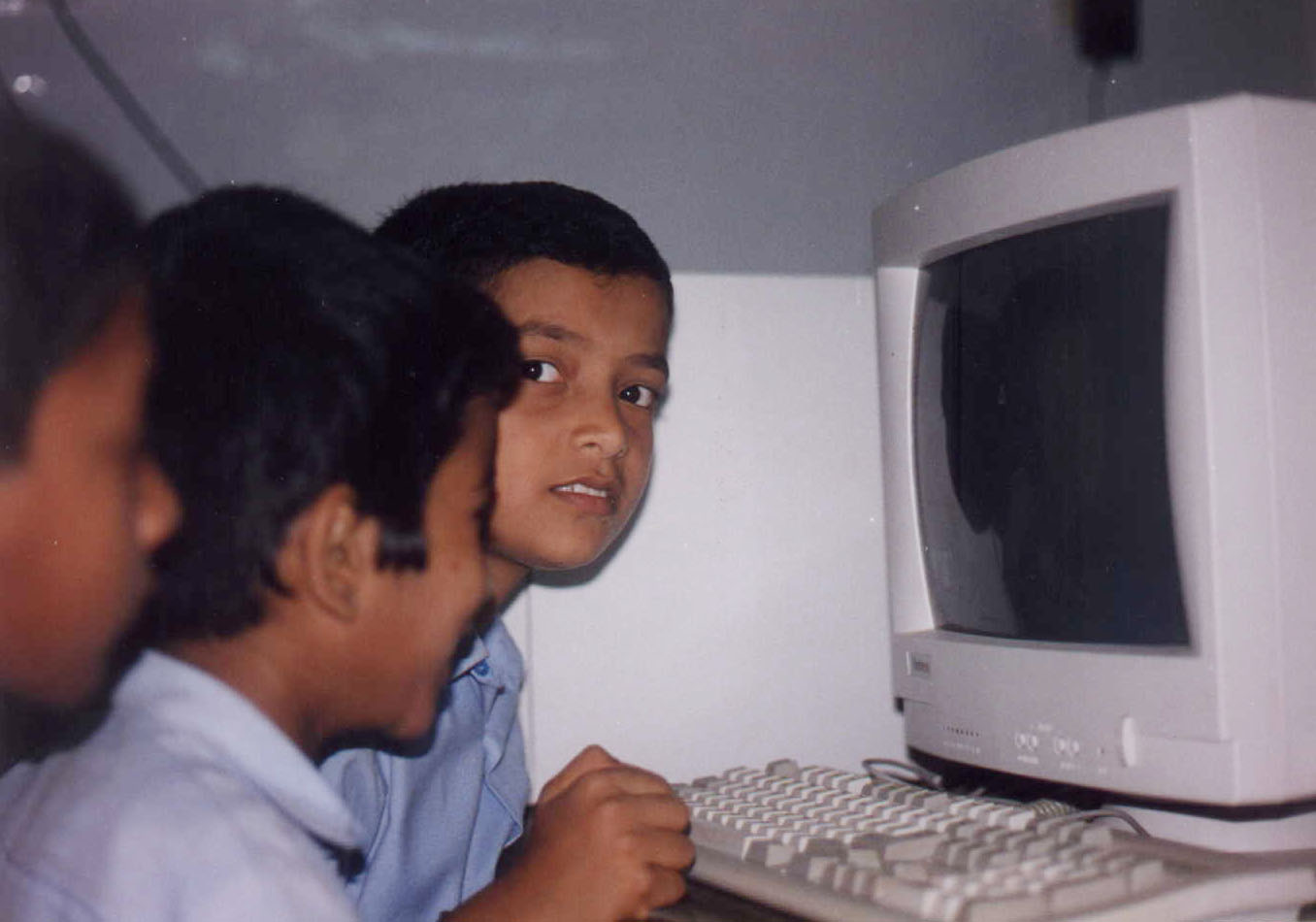 Kids learning computers at school.