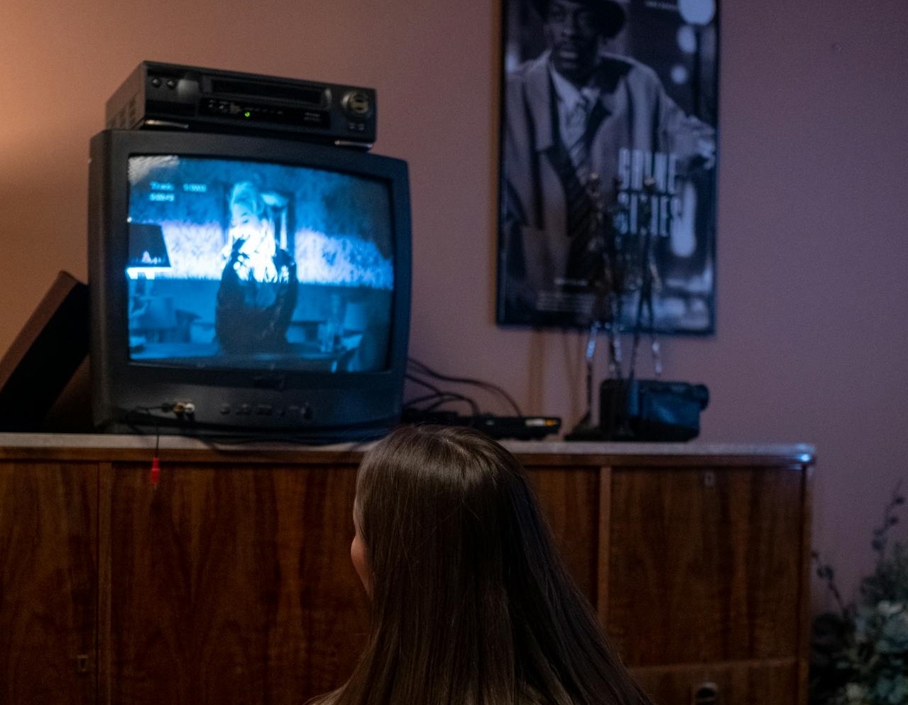 Young girl watching TV