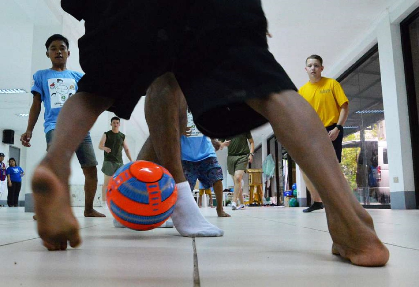 Kids playing football.