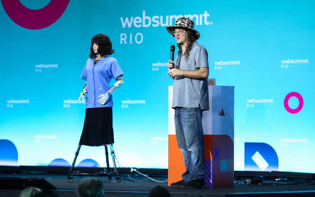 Grace, the robot nurse, left, and Ben Goertzel, Founder & CEO, SingularityNET