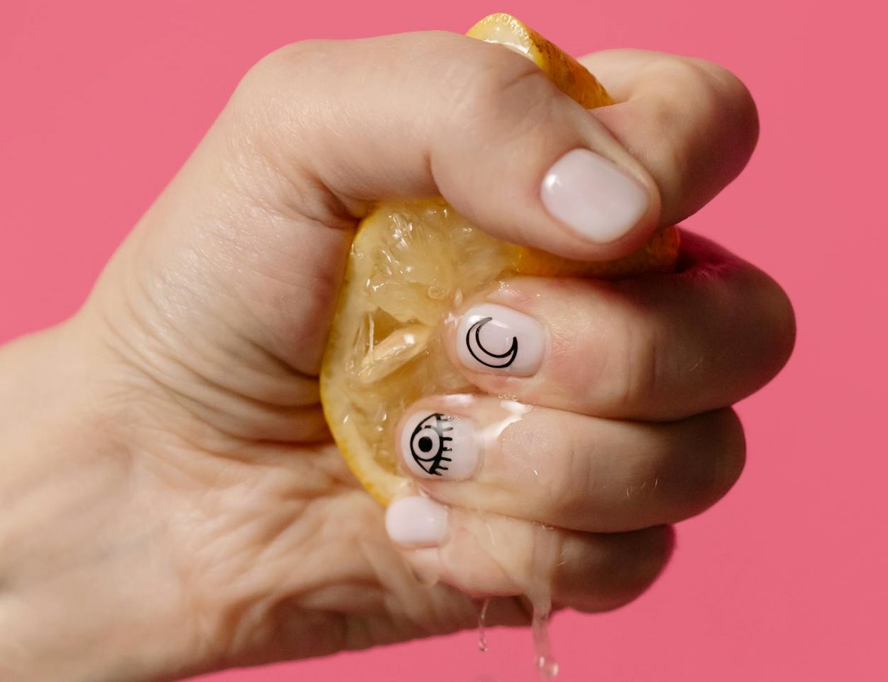 Person Squeezing Lemon.