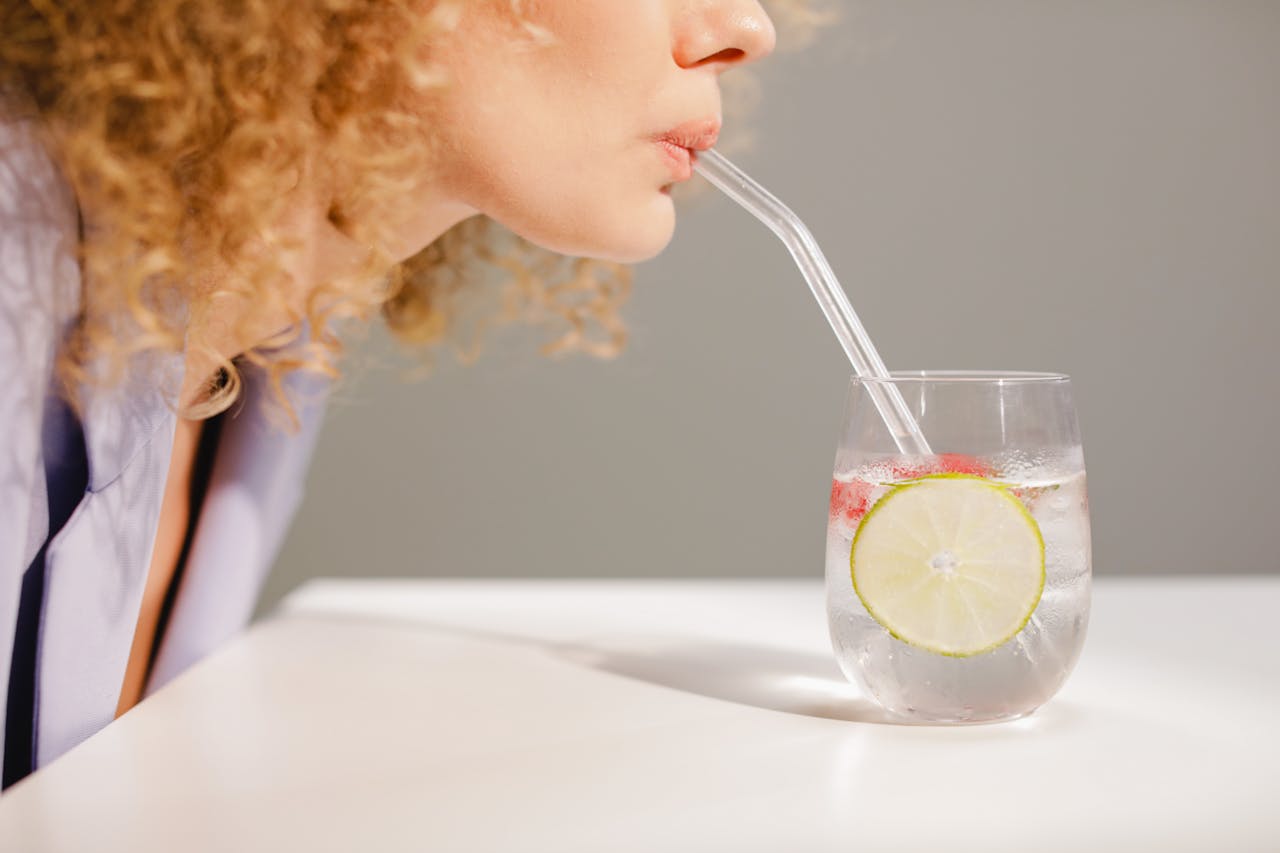 Woman drinking lemon water
