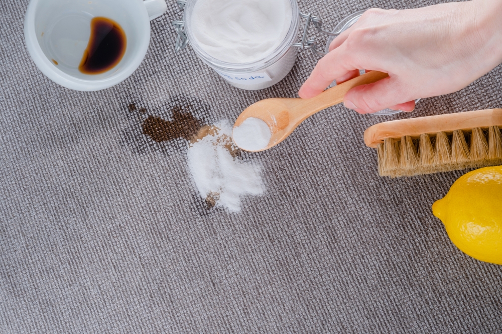 image of a woman cleaning sofa with soda