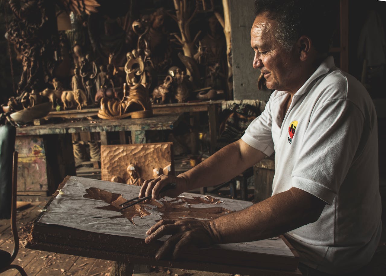 Man making wooden sculpture