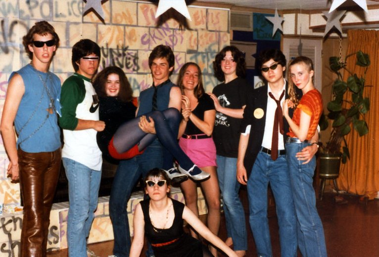 Teenagers dressed in Punk / New Wave Outfit at a party.