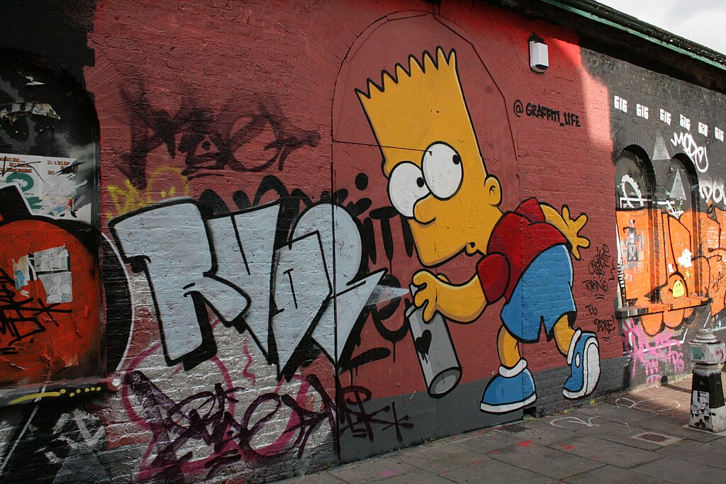 Graffiti of Bart Simpson on a wall.